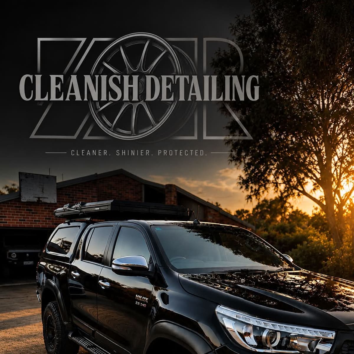 Cleanish Detailing branded photo of a polished black pickup truck at golden hour.
