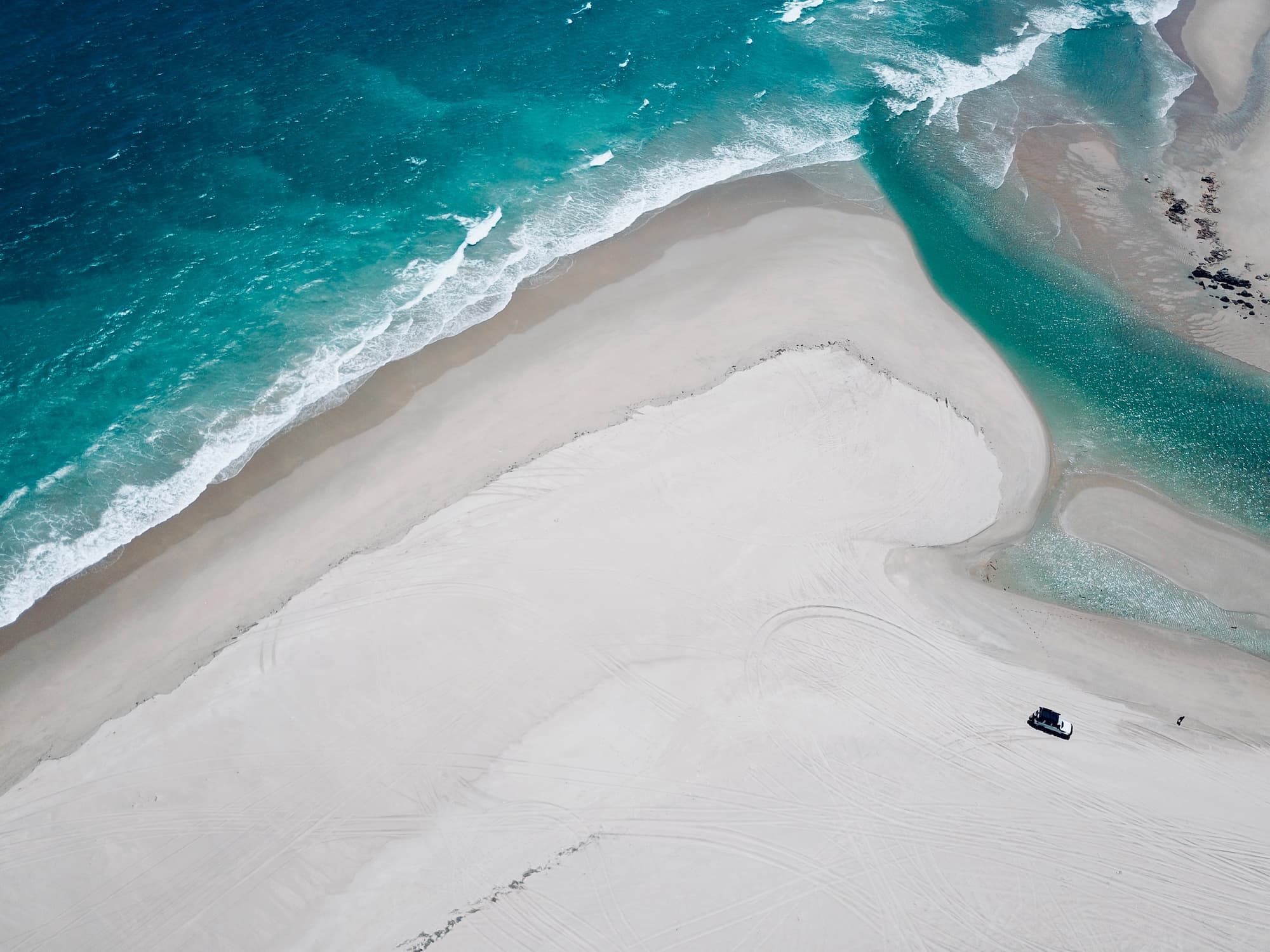 Aerial photo of a beach in the south west of Australia with an inlet